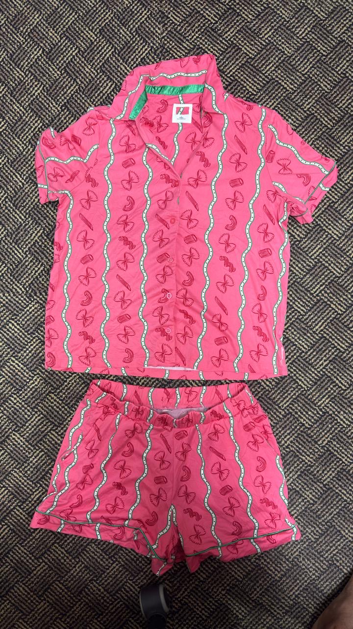 Historical third-party reference: pink printed short-sleeve shirt and matching shorts